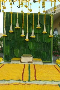 an outdoor stage decorated with yellow and green decorations