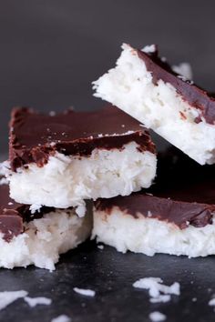 chocolate and coconut bars stacked on top of each other