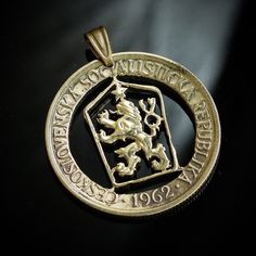 "Beautiful Cekoslovakian old Cut coin pendant, looks nice.  Coat of arms of Czechoslovakia, a Czech lion with Slovak shield and a socialist star. Comes with a brass color ball chain 70 cm.  If you have any questions, please let me have them, and don't fail to check out the others I have cut from this series. Policy My aim is to offer you a high quality cut coin pendant, which will be an unforgettable unique piece of art and history. You won`t be unnoticed! I offer a huge variety of coins. If you Cut Coin Jewelry, Custom Coins, Map Pendant, Coin Pendant Necklace, World Coins, Handmade Jewelry Gift, Coin Jewelry, Art Unique, Coin Necklace