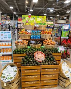 an assortment of fruits and vegetables on display in a grocery store