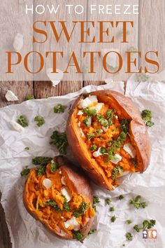 two sweet potatoes with cheese and parsley on top, sitting on white parchment paper