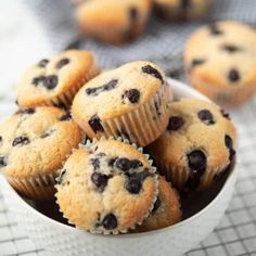 blueberry muffins in a white bowl on a table