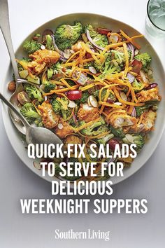 a bowl filled with salad next to a glass of water