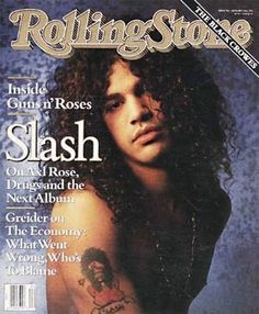 the cover of rolling stone magazine with slash on his chest and arm, wearing tattoos