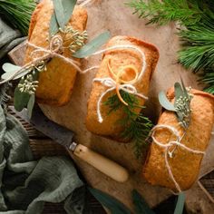 three slices of bread tied with twine and sprigs