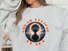 Solar Eclipse at Sea Unisex Crewneck Sweatshirt-Celestial Fashion,Gift for science nautical adventurer sailor yatch ship boatin cruise lover by Creative2022Store on Etsy Celestial Fashion, Solar Eclipse, Cozy Sweatshirts, For Lovers, Astronomy, Crewneck Sweatshirt