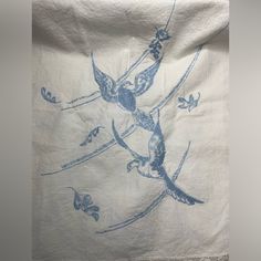 a white towel with blue birds on it