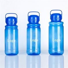 three blue water bottles sitting next to each other