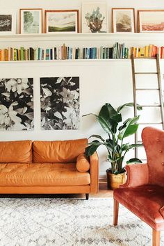 a living room filled with furniture and bookshelves