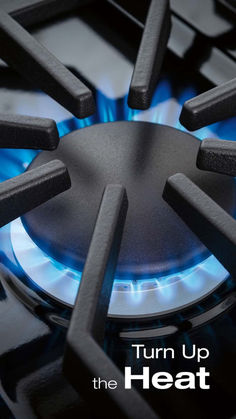 a gas stove with the words turn up the heat on it's burners