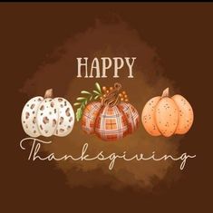 three pumpkins with the words happy thanksgiving written in white and orange on brown background