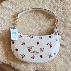 Gorgeous New With Tags Coach Ladybug Floral Payton Hobo Shoulder Bag Is In Excellent New Condition. Stunning Chalk Leather With Adorable Red Ladybug And Pink Fliral Design And Gold Logo Badge And Hardware. Top Zipper Closure With 1 Open Sidewall Pocket Inside. Tags, Booklet, And All Packing Materials Are Included. It Measures Approximately 11" By 7 1/2". Guaranteed Authentic. A Very Sweet And Dressy Bag For That Special Outing! From Non-Smoking Home. Cute Coach Bags, Pink Gift Ideas, Hobo Shoulder Bag, Cute Handbags