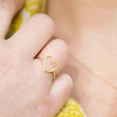 This Gold Open Heart Ring makes a wonderful gift for friend, or for the one you love. Made of solid 9ct yellow, our signature Storybook texture features heavily on this heart ring design, making it perfect to mix and match with other pieces from the Storybook and Happily Ever After collections. The heart measures around 12mm tall. Heart Ring Design, Open Heart Ring, Gold Heart Ring, Stacker Rings, Tarnished Jewelry, Ringe Gold, Silver Stacking Rings, Open Heart, Small Heart