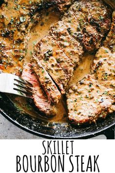 skillet bourbon steak in a pan with a fork