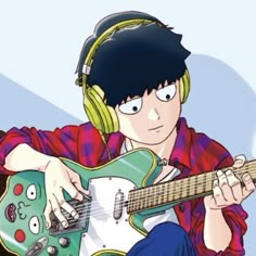 a man with headphones playing an electric guitar