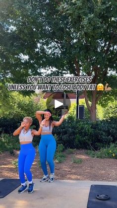 two women in blue pants are doing exercises