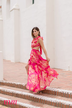 Make a show-stopping entrance with The RoryMaxi Dress. With its sexy side and back cut outs, short ruffle sleeves, and front ruffle slit, this floral-print stunner is sure to grab all the attention. Perfect for a spring time wedding or your next tropical vacation. Spring Time Wedding, Flowy Dress Long, Floral Print Maxi Dress, Floral Print Maxi