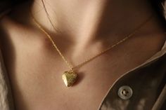 Wear your heart on your sleeve (or your neck) with our Love Locket Necklace. Made with durable, gold filled material, this necklace is perfect for everyday wear. Show your support for love in all forms with our love is love necklace. Material Information: If you need a chain of a specific, shorter length than what is available, please feel free to request it—we can customize the chain to any size to guarantee a perfect fit. When placing your order, choose the nearest longer chain length availabl Everyday Gold Heart Necklace With Adjustable Chain, Everyday Gold Pendant Locket Necklace, Everyday Gold Locket Necklace With Adjustable Chain, Meaningful Heart-shaped Everyday Jewelry, Meaningful Everyday Heart Jewelry, Dainty Locket Necklace For Everyday, Gold Heart Pendant Necklace For Everyday, Everyday Heart Locket Necklace For Valentine's, Everyday Gold Locket Jewelry