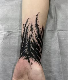 a person's arm with some black ink on it