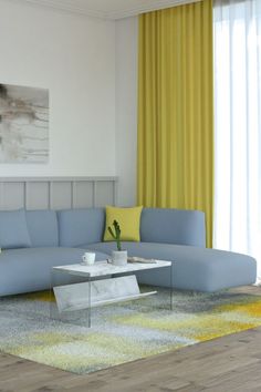 a living room filled with furniture and yellow drapes