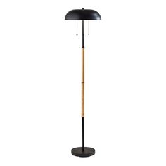 a black floor lamp with a wooden stick on the base and a light shade over it