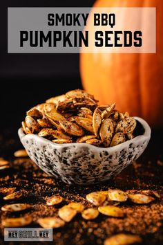 smoky bbq pumpkin seeds in a white bowl with the words smoky bbq pumpkin seeds