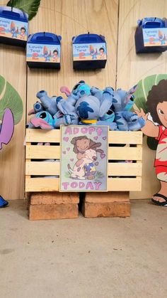 there are two wooden crates with cartoon characters on them