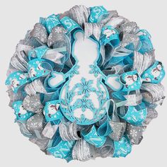 a blue and silver wreath with snowmen on it