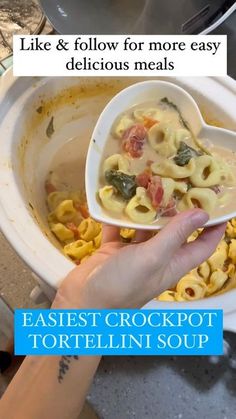 a person holding a spoon over a bowl of food