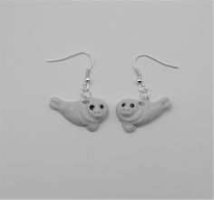 Handcrafted porcelain  Seal earring on  sterling silver hooks comes in a presentation box Seal Earrings, Pokemon Jewelry, Handcrafted Ceramics, Sterling Silber, Jewelry Earrings Dangle, Dangle Drop Earrings, Dangle Earrings, Presentation, Handmade Items