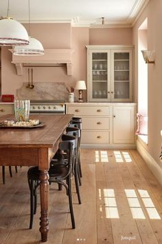 a dining room table and chairs in a kitchen