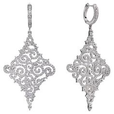 A delicate pair of drop earrings, intricately designed oozing instant Hollywood glamour. Featuring 8.00ct of round brilliant cut cubic zirconia, suspended from a lever back fastening, stunningly handcrafted in 925 sterling silver with a high gloss white rhodium finish. Dimensions 60mm drop by 30mm diameter. Also available with a 14kt rose gold finish. English Art, Silver Lace, Rose Lace, Statement Drop Earrings, Hollywood Glamour, Round Brilliant, Gold Finish, High Gloss, Statement Earrings