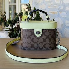 Guaranteed Authentic Brand New With Tags Attached Coach Signature Kay Crossbody Handbag Trunk Bag Sv/Khaki Pale Lime Nwt Womens 100% Authentic Brand: Coach Name: Signature Kay Crossbody Brd Color: Khaki Pale Lime Model: Cj613 Measurement: (W) 7.75" (H) 5.25" (D) 3.75" Handle Drop: 2.5" Strap Drop: 22.5" Adjustable/Detachable Pale Lime Smooth Leather And 2 Toned Khaki Medium "C" Coated Canvas Silver 'Coach Heritage Coach Emblem Closure: Lid W/ Turn Lock Hardware: Silvertone Stitching: Pale Lime/K Green Rectangular Coated Canvas Bag, Green Coated Canvas Bag With Top Carry Handle, Green Coated Canvas Shoulder Bag For On-the-go, Green Coated Canvas Satchel Tote, Green Coated Canvas Tote Satchel, Green Coated Canvas Shoulder Bag For Daily Use, Green Coated Canvas On-the-go Shoulder Bag, Green Bucket Box Bag For Shopping, Green Coach Bag With Adjustable Strap