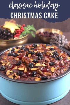 a christmas cake in a blue pan with the words classic holiday christmas cake above it