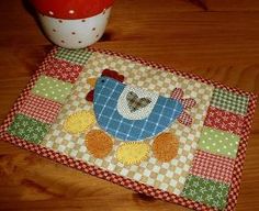 a placemat with a chicken on it next to a cup