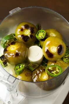 some green peppers are in a food processor