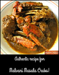 a white plate topped with meat covered in gravy