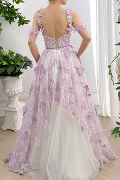 Elevate your style with our Corset Butterfly Tulle Long Dress. Featuring a removable off-the-shoulder design, this dress exudes elegance and grace. The corset cinches your waist, while the butterfly tulle fabric adds a touch of whimsy. Turn heads at your next event with this stunning and versatile dress. Bust and Skirt with full lining. 100% Polyester 100% Recycled polyester lining Concealed zip at center back Imported White Off-shoulder Dress For Debutante Ball, Off-shoulder Prom Dress With Corset Back, Elegant Off-shoulder Dress For Debutante Ball, Off-shoulder Tulle Dress For Debutante Ball, Purple Off-shoulder Wedding Dress, Purple Off-shoulder Dress With Fitted Bodice, Off-shoulder Corset Dress With Fitted Bodice For Wedding, Off-shoulder Corset Dress For Spring Wedding, Spring Wedding Off-shoulder Corset Dress