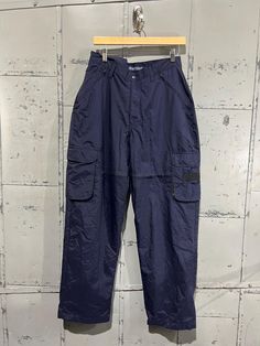 Great Condition, nothing to note! Great for hiking the legs have vents  Shell 100% nylon Lining 100% poly Tagged 32, Measurements taken with garment laid flat: 16" across the waist  21" across hips 31" inseam, from intersection to hem 14" rise, from intersection to top of waist 9.5" leg opening Full-length Nylon Cargo Parachute Pants, Baggy Full-length Nylon Cargo Pants, Nylon Wide-leg Parachute Pants With Pockets, Full-length Nylon Parachute Pants With Cargo Pockets, Urban Nylon Cargo-style Parachute Pants, Trendy Streetwear, Track Pants, Cargo Pants, Granola