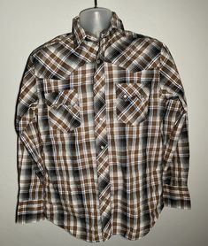 This is a Vintage Wrangler Western Fashion Pearl Snap Plaid PolyCotton long sleeve shirt in a mens size medium, style WM961BR. It measures 22" from armpit to armpit across the chest, and 31" from the top of the collar to the bottom of the shirt. All measurements taken when shirt was laying flat. No rips, some light pilling under arms. Please see photos for details. I will be listing other clothes and will combine shipping on multiple orders. Western Brown Tops For Winter, Brown Western Tops For Winter, Country Style Long Sleeve Top For Country Events, Brown Western Style Top For Winter, Brown Long Sleeve Shirt With Snap Buttons, Fitted Long Sleeve Shirt For Western-themed Events, Casual Brown Tops For Western-themed Events, Country Style Shirt For Fall Rodeo, Long Sleeve Brown Shirt For Ranch