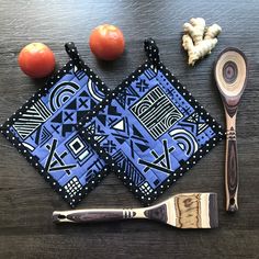 a wooden table topped with utensils and fruit