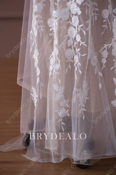 This trendy beautiful bridal lace fabric features exquisite beaded flowers and leaves embroidered on the tulle base, which evokes glamour and fashion. It could be used on elegant wedding dresses, special occasion garments and DIY projects. shown color light ivory sold by the yard content polyester, nylon, PET elasticity no width 135cm weight medium weight washing instructions hand wash/drip dry Wedding Lace Tulle Fabric With Floral Applique, Floor-length Lace Wedding Dress With Delicate Lace, Floor-length Wedding Dress With Delicate Lace, Bridal Lace Dresses With Intricate Embroidery, Floral Embroidery Net Dress For Wedding, White Floor-length Lace Wedding Dress, Net Dress With Floral Embroidery For Wedding, Elegant Wedding Dresses, Bridal Lace Fabric