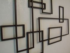 several square and rectangle metal wall art pieces