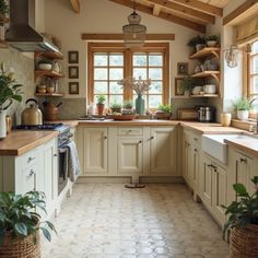 a kitchen filled with lots of counter top space next to a stove top oven and sink