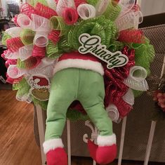 a christmas wreath that has been placed on top of a baby's crib