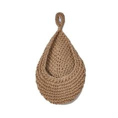 a woven bag hanging from the side on a white background, with a rope attached to it