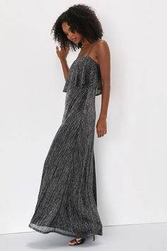 The way you sparkle in the Lulus Elegant Shimmer Shiny Black and Silver Plisse Maxi Dress will grab everyone's attention! Stretchy plisse fabric, with silver lurex threading throughout, shapes this stunning dress that falls from adjustable spaghetti straps into a straight neckline with a flouncy overlay atop a fitted bodice. High, fitted waist sits atop a flowing A-line skirt that ends at an elegant maxi hem. Hidden back zipper/clasp. Fit: This garment fits true to size. Length: Floor length. Si Glamorous Metallic Maxi Dress For Party, Glamorous Shimmer Maxi Dress For Gala, Glamorous Metallic Maxi Dress For Party Season, Glamorous Glitter Dresses For Evening, Glamorous Metallic Maxi Dress, Glamorous Glitter Maxi Dress For Evening, Glamorous Metallic Dress, Evening Shimmer Dresses, Glamorous Shimmer Maxi Dress For Formal Events