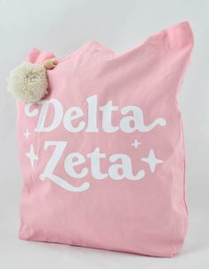 Represent your sorority spirit with our Retro Pom Pom Tote Bag! Perfect for carrying books, as a laptop bag, beach carry all or even an everyday purse! Our tote is made in the color of your organization, features a super trendy retro script, and even includes a fluffy yarn pom pom with wooden bead detail.* Canvas material* Measures 15" x 15"* Vibrant color, organization specific* Yarn Pom Pom with wooden beads attached* Trendy Retro Script Color Organization, Pom Pom Tote Bag, Fluffy Yarn, Mobile Wallet, Everyday Purse, Yarn Pom Pom, Tote Bag Design, Sorority