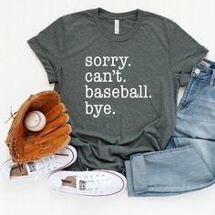 a t - shirt that says sorry can't baseball bye next to some shoes