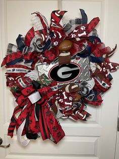 a football wreath is hanging on the door